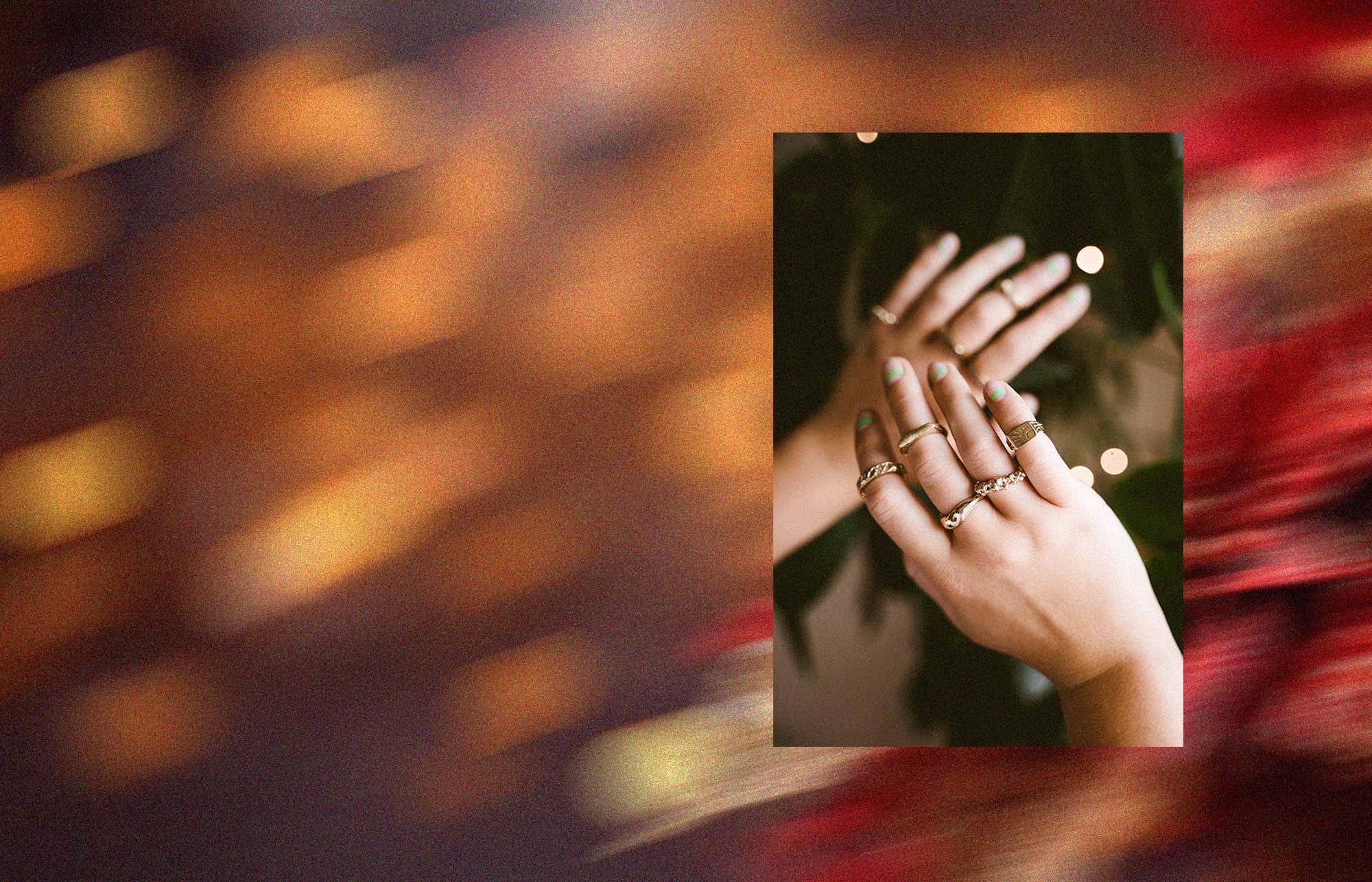 Close-up of hands with rings on a blurred background